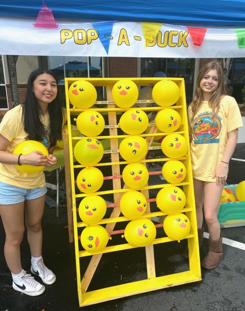Volunteers at the Pop-a-Duck game booth at the Charleston Charity Duck Race